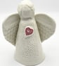 Porcelain Angel sculpture with red heart - Image 1