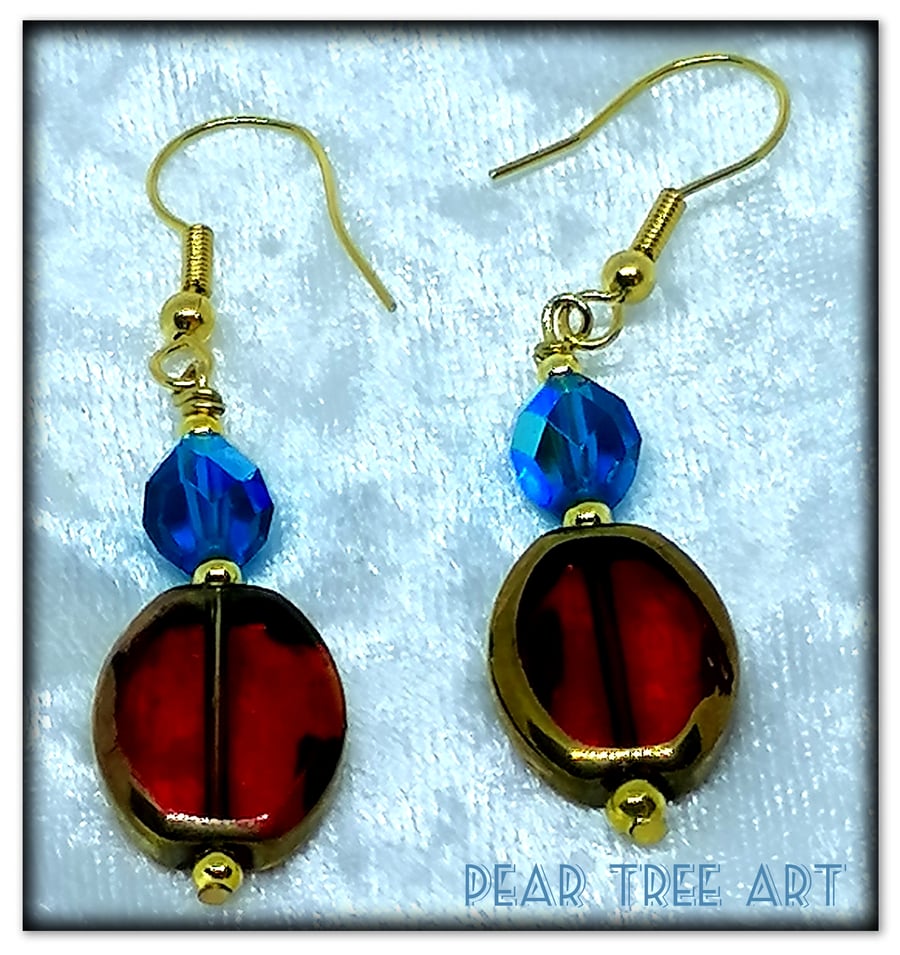Red Glass beads earrings with turquoise crystal beads on gold plated hooks.