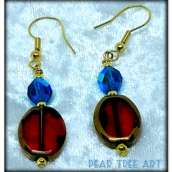 Red Glass beads earrings with turquoise crystal beads on gold plated hooks.