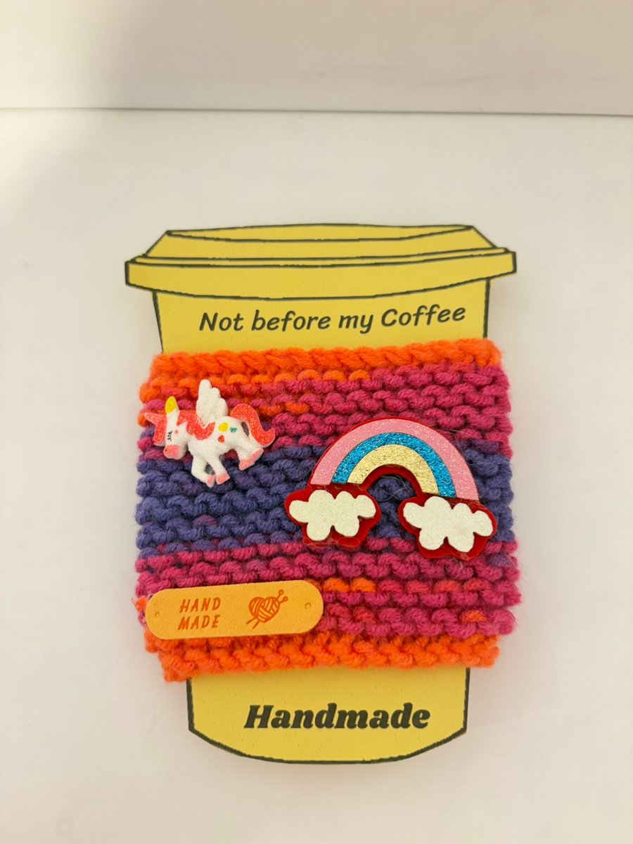 Unicorn rainbow hand knitted cup cosy. 