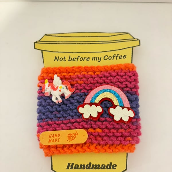 Unicorn rainbow hand knitted cup cosy. 