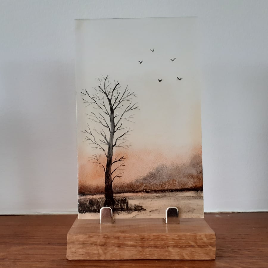 Hand painted enamel on glass landscape panel, bare winter tree