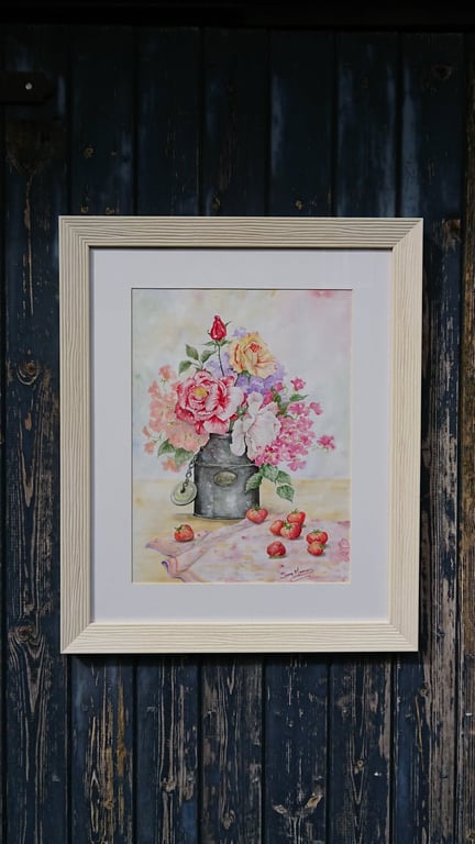 Roses and sweet peas in tin cream churn with strawberries