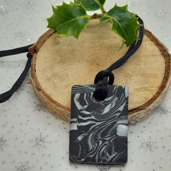 Sparkly silver and black rectangular pendant