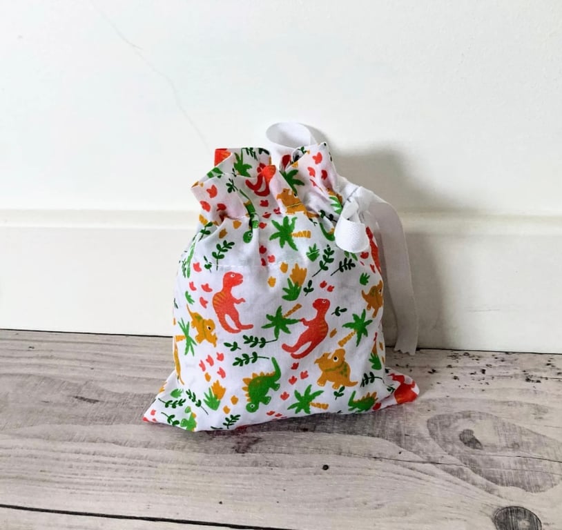 White Dinosaur Fabric Drawstring Gift Bag: Reusable XS Present Wrap.