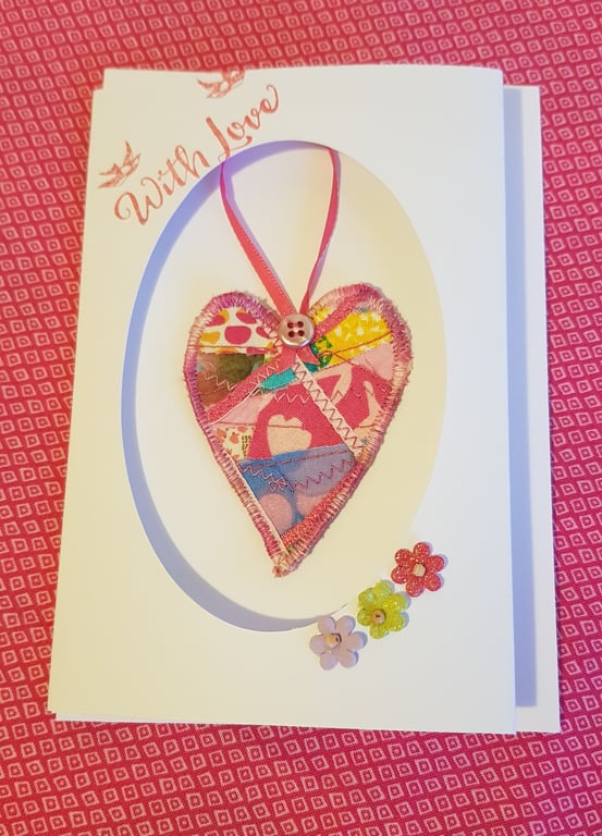 Textile heart decoration in a card