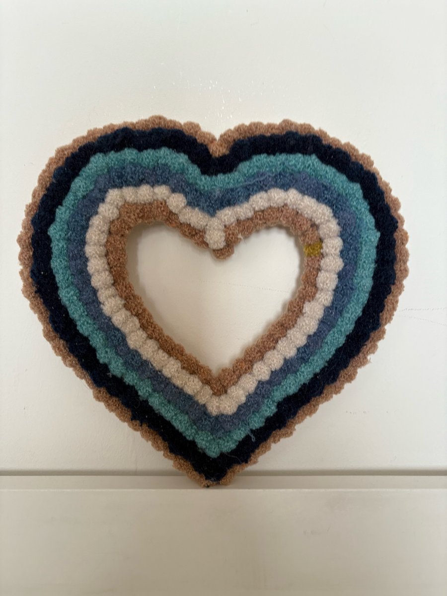 Baby shower blue Pom Pom decorated wood heart. 