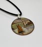 Landscape pendant with castle and boat