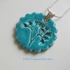 Ceramic turquoise pendant impressed with "weeds" -  sterling silver