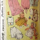 A vintage sewing pattern for a baby's layette in one size (Simplicity 1443)