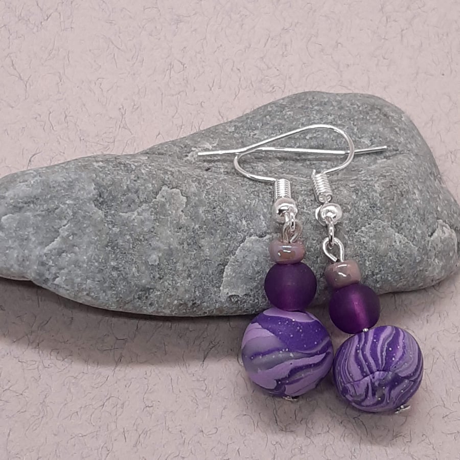 Polymer clay dangly earrings in sparkly purple, lilac and silver