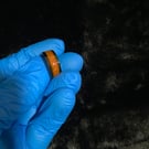 Resin ring with pink glitter and light orange base 