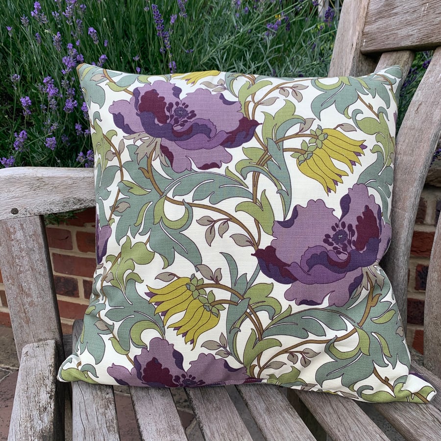 Cushion cover with purple flowers