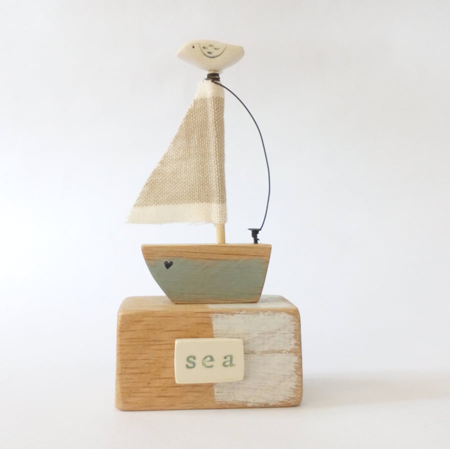 SALE - Handmade little wooden sail boat with clay bird