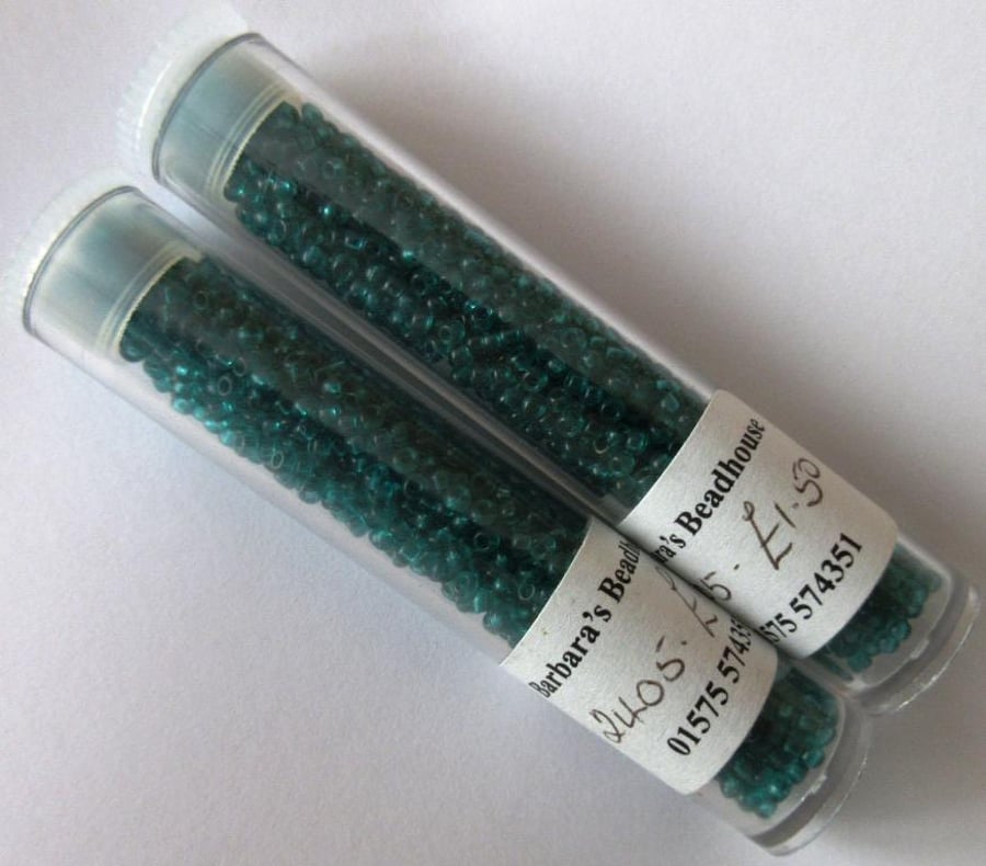 Two tubes of turquoise green seed beads suitable for jewellery, knitting etc