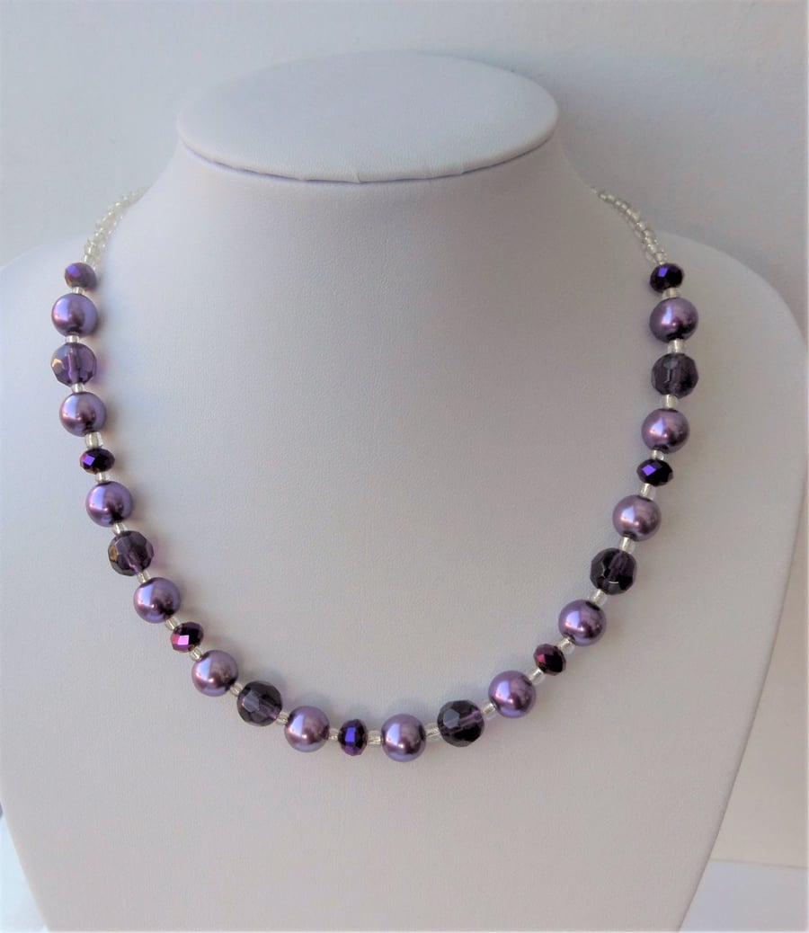 Purple glass bead necklace.