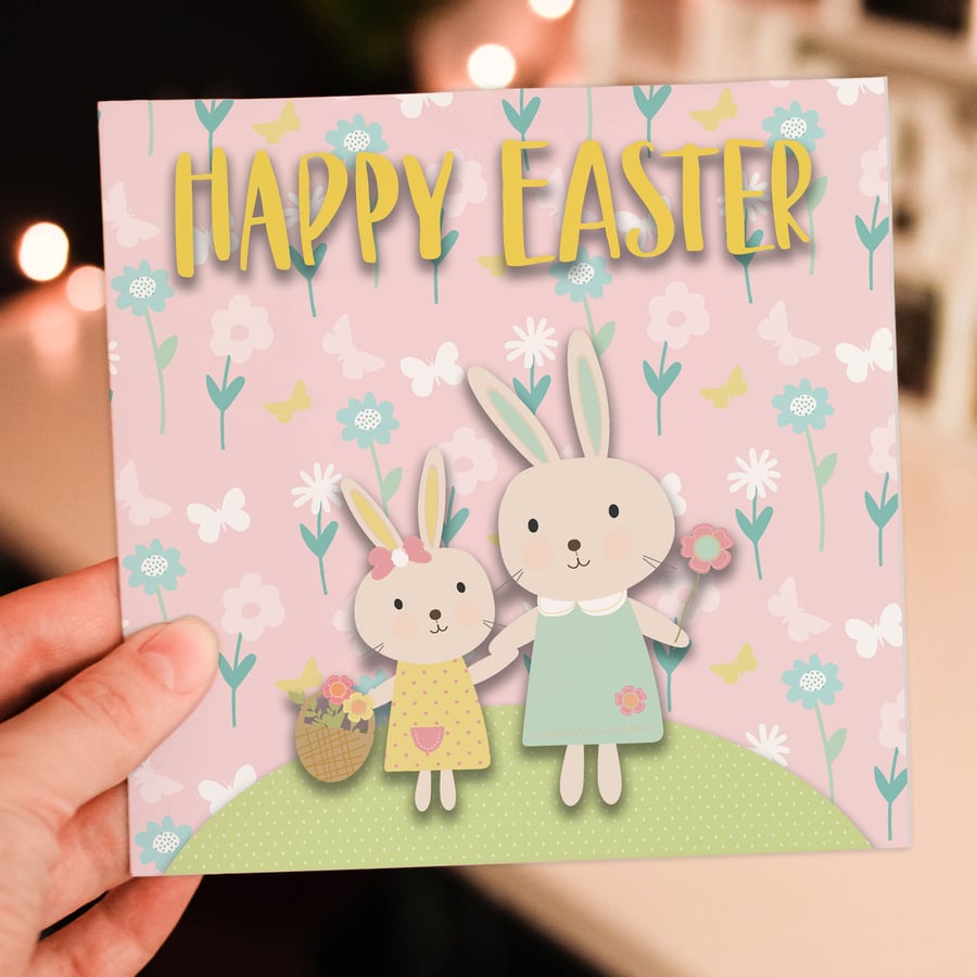 Easter card: Bunny rabbits on a hill