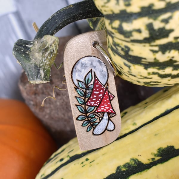 Red Mushrooms under a Full Moon. Pyrography keyring.