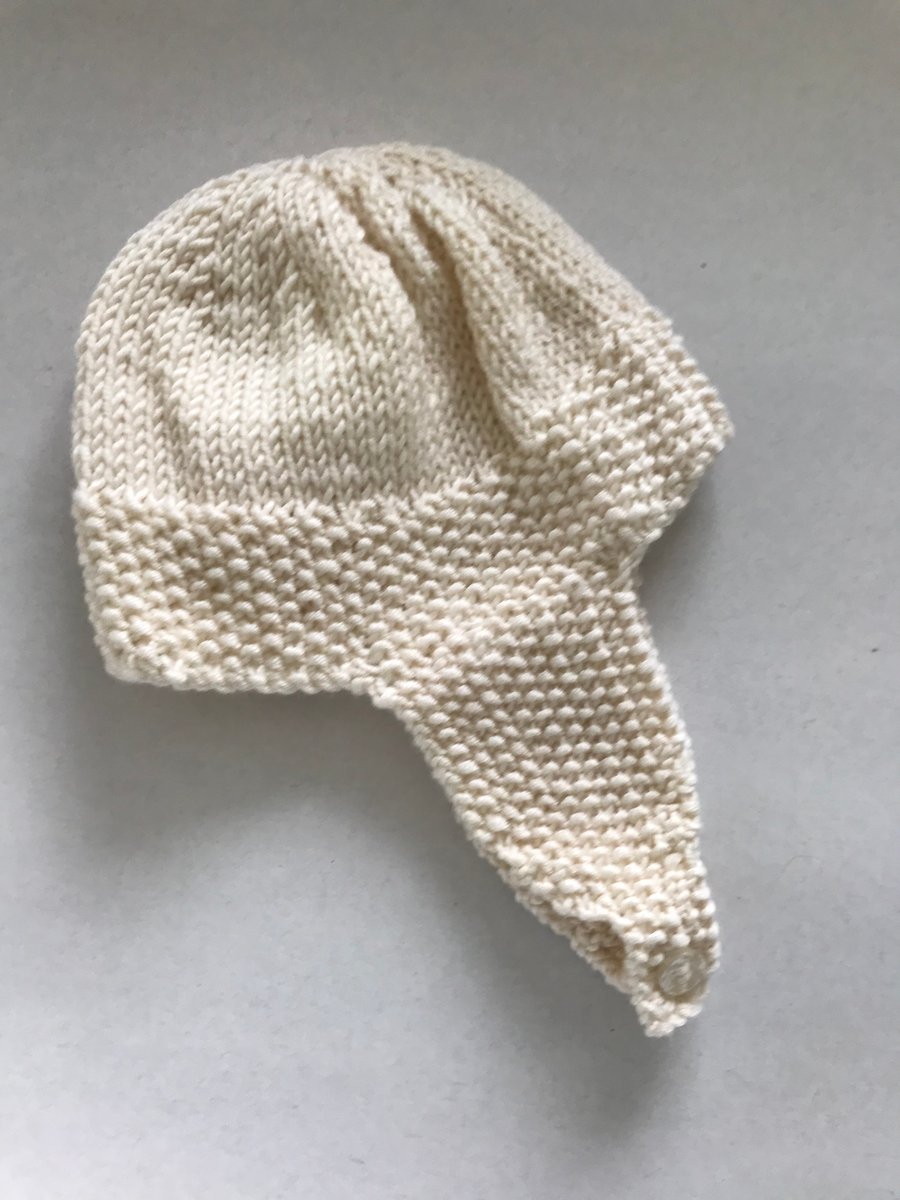 Hand knitted baby retro style hat with earflaps