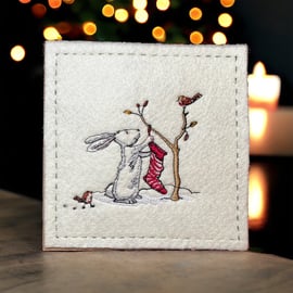 Handmade embroidered Christmas Card featuring Hare with Christmas Stocking