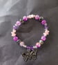 Elasticated pastel goth beaded bracelet with skull and butterfly charm - Image 4