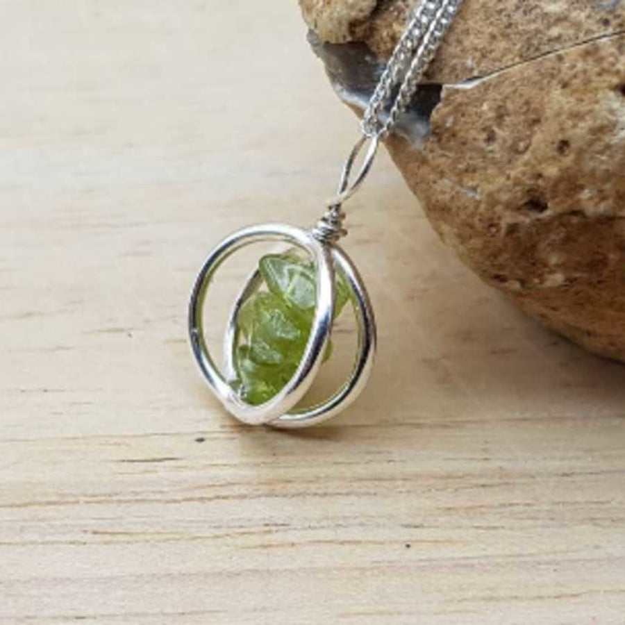 Peridot necklace. August birthstone pendant. Sterling silver circle