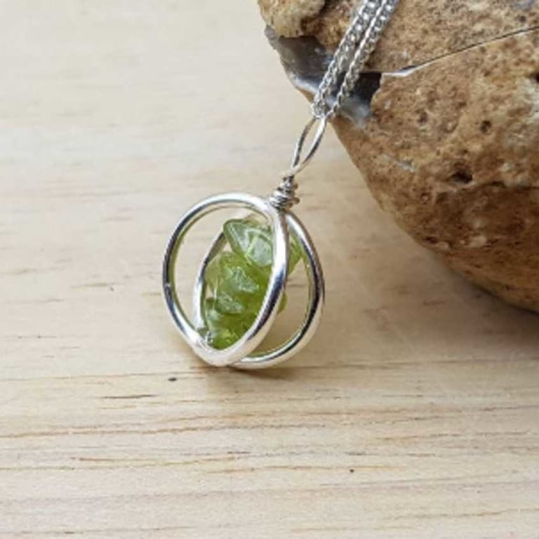 Peridot necklace. August birthstone pendant. Sterling silver circle