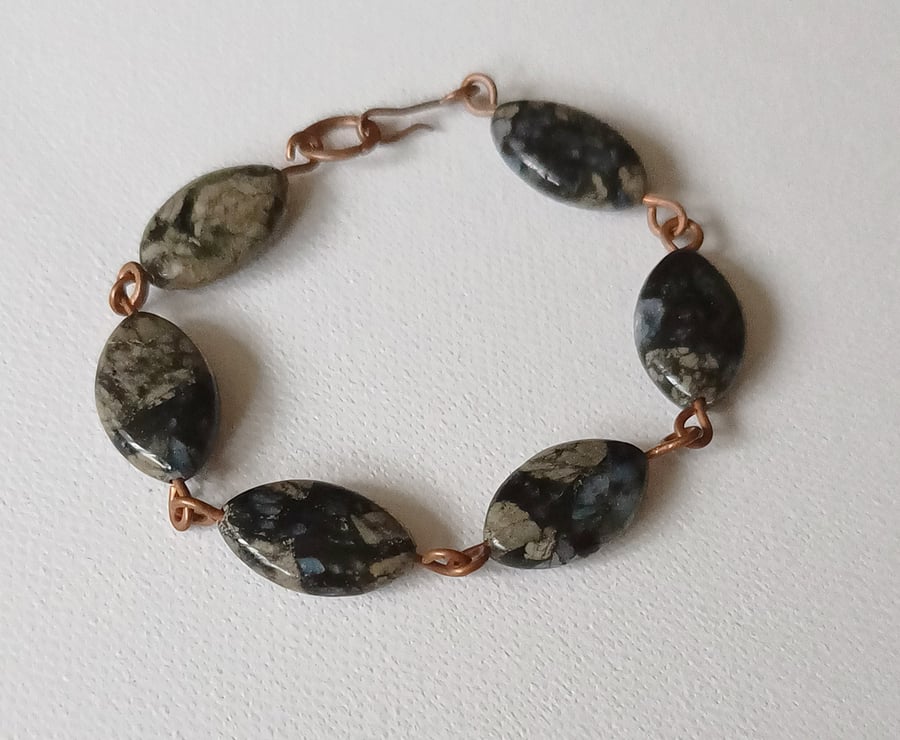 Copper bracelet with reconstructed stone