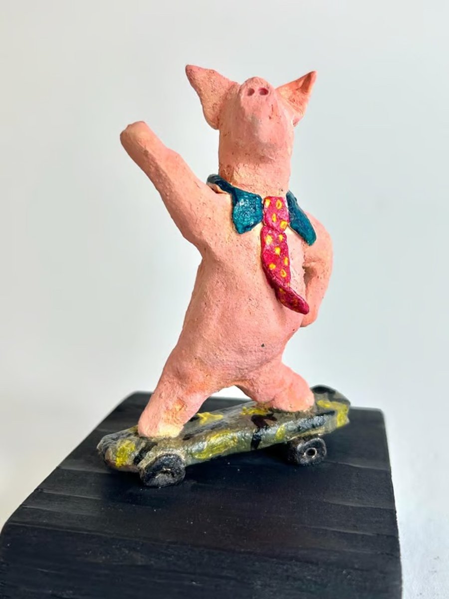 Hand-Built Ceramic Skateboard Pig Sculpture on Wood Block