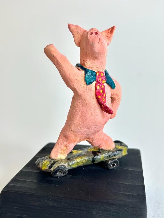 Hand-Built Ceramic Skateboard Pig Sculpture on Wood Block