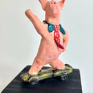 Hand-Built Ceramic Skateboard Pig Sculpture on Wood Block