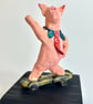 Hand-Built Ceramic Skateboard Pig Sculpture on Wood Block - Image 1