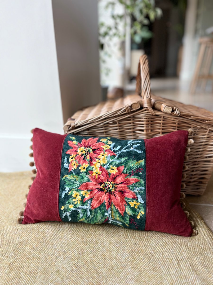 Orange and yellow floral tapestry cushion with pompoms