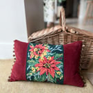 Orange and yellow floral tapestry cushion with pompoms