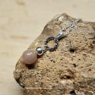 Small circle rope sunstone pendant. Peach July birthstone necklace.