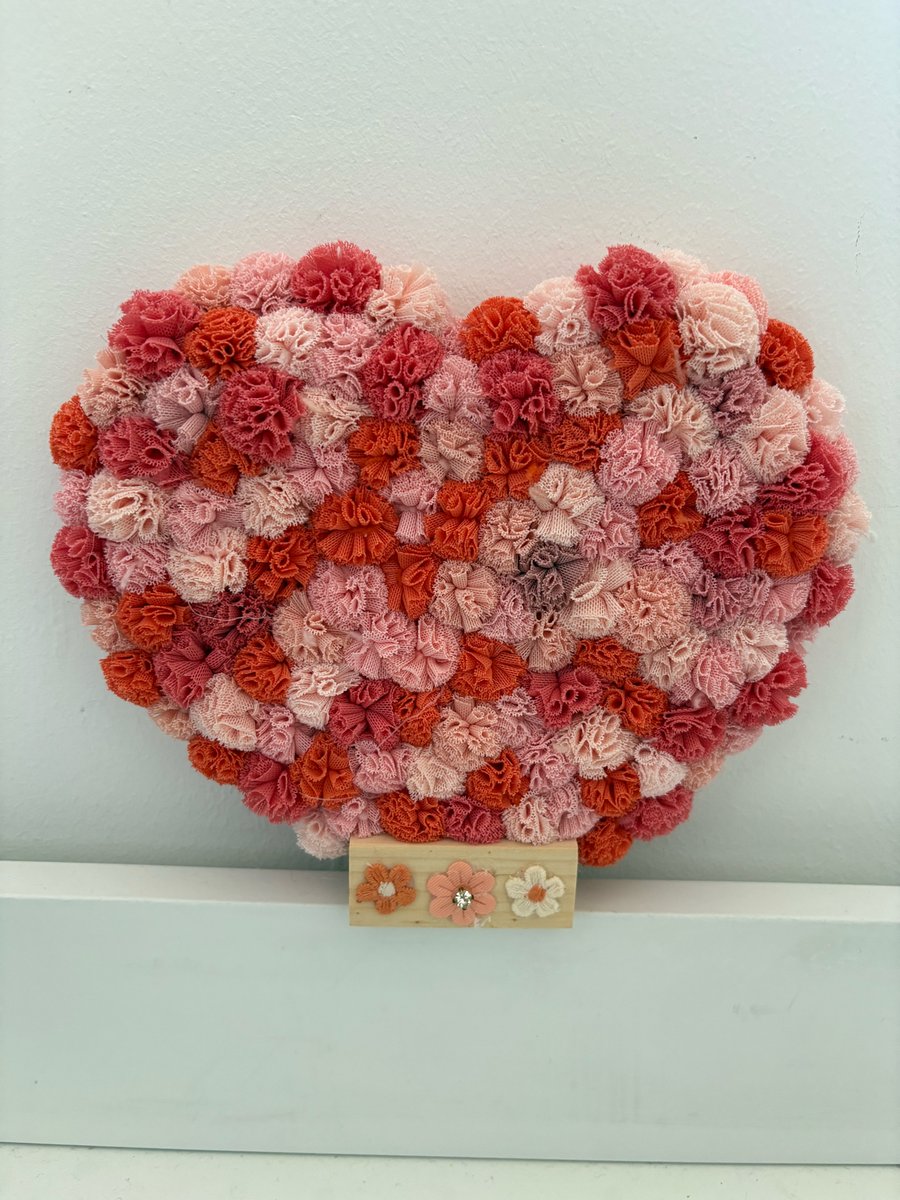 Peach Melba scrunchy Pom Pom decorated acrylic heart in stand. 