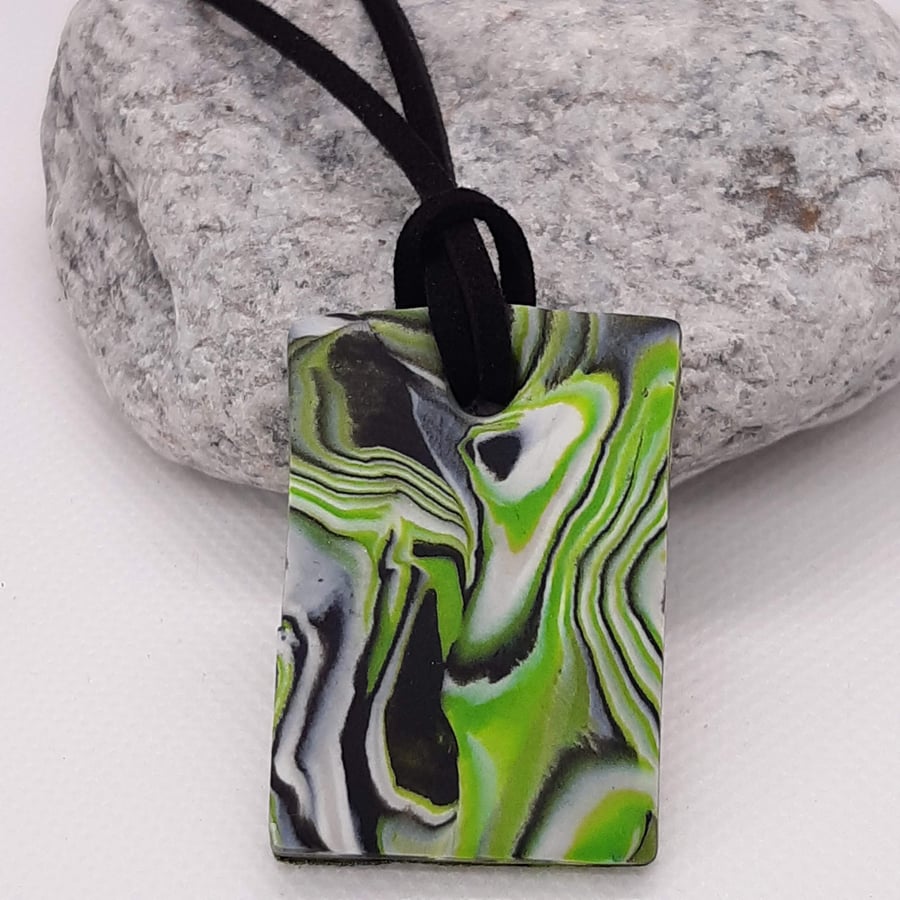 Bright green and black rectangular polymer clay pendant