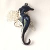 pendant - seahorse, scrolled white and gold over dark blue