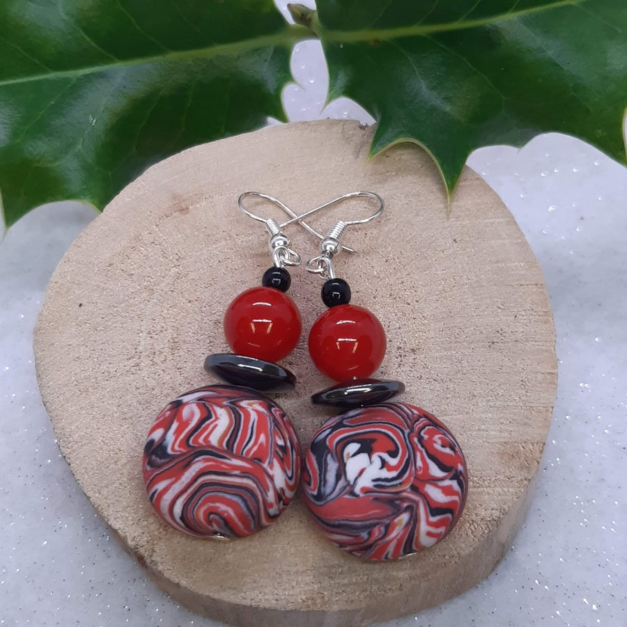 Disc shaped dangly earrings