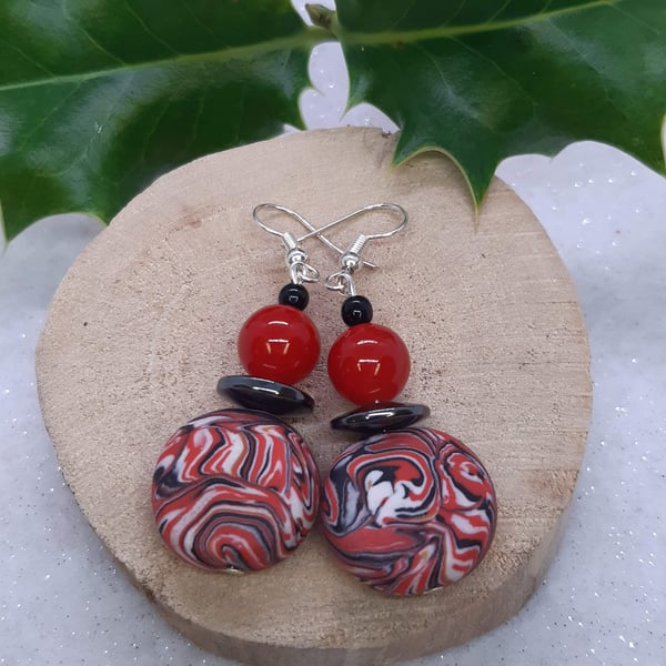 Disc shaped dangly earrings