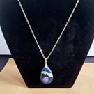 Blue shells in resin pendant