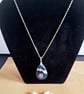 Blue shells in resin pendant