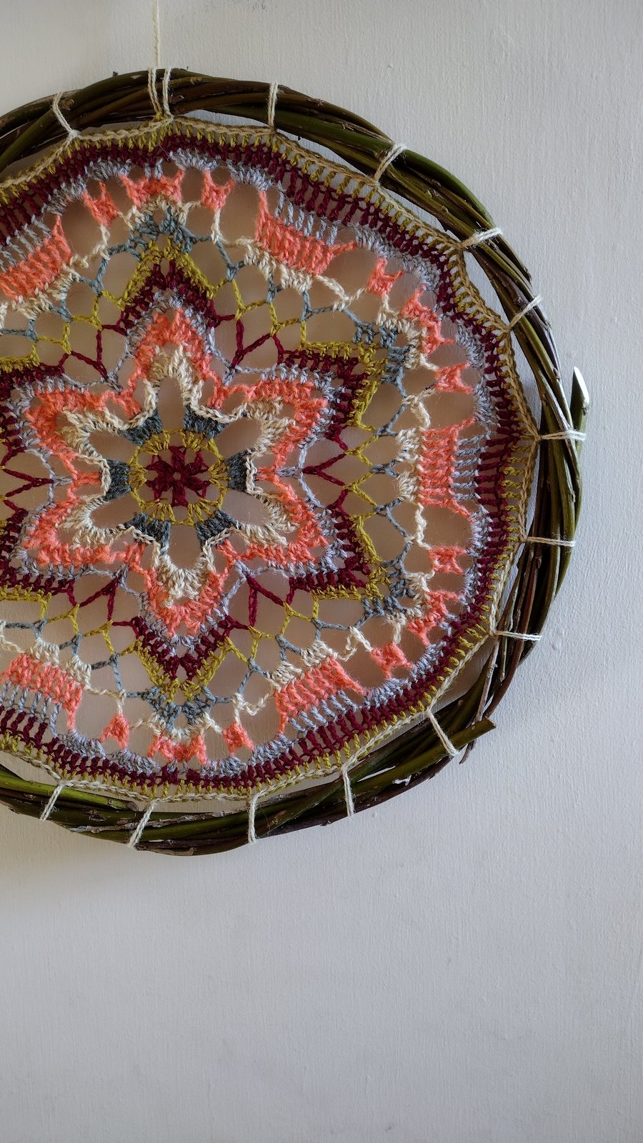 Multicoloured mandala in willow hoop