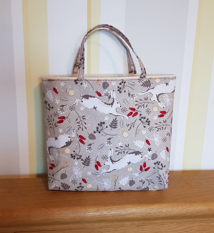Christmas gift bag: dancing hares on taupe 