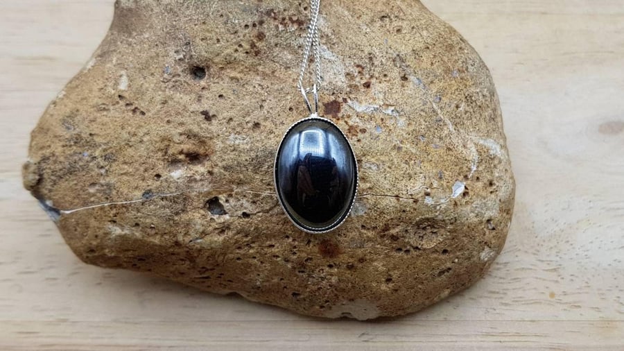 Simple oval Hematite pendant. Reiki jewellery. 18x13mm