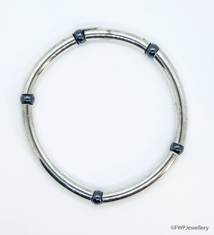 Stylish Silver Tube Bangle with Hematite Beads