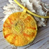 Sun embroidered necklace.