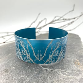 Turquoise anodised aluminium ‘Winter Tree’ cuff