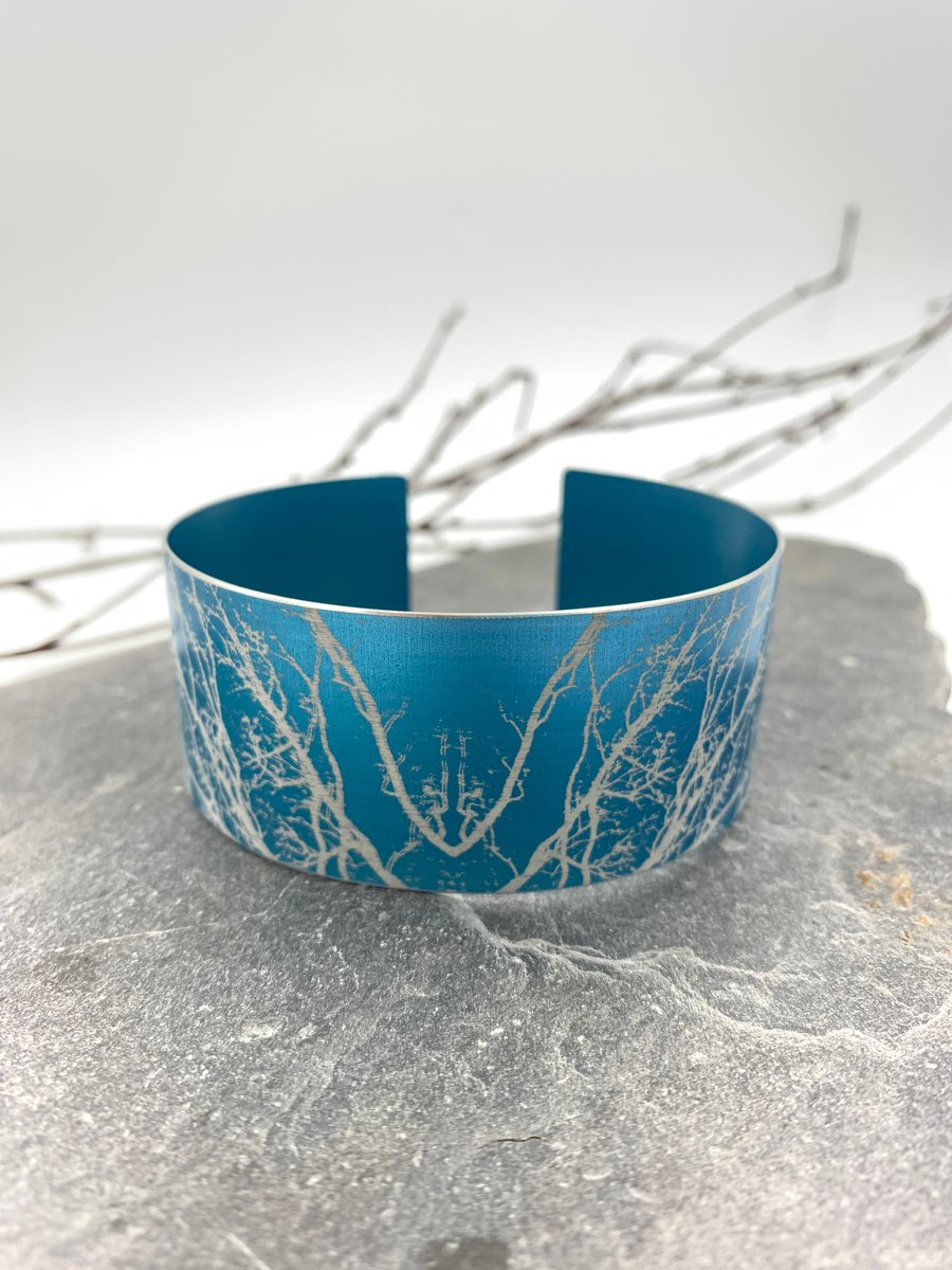 Turquoise anodised aluminium ‘Winter Tree’ cuff