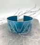 Turquoise anodised aluminium ‘Winter Tree’ cuff